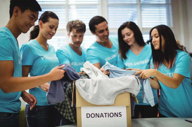 group-volunteers-checking-clothes